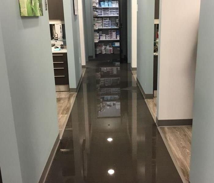 standing water in hallway of commercial building