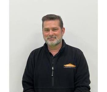 Male Employee smiling with white background