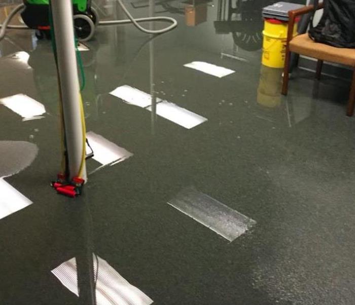 water covering therapy room floor in commercial building