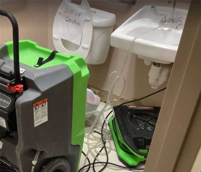 equipment set in bathroom after toilet overflow